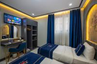 A bed or beds in a room at Hotel California