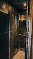 a shower with a glass door in a bathroom at Chalet Camillou in Champagny-en-Vanoise