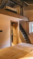a bedroom with a staircase in a house at Chalet Camillou in Champagny-en-Vanoise