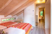 A bed or beds in a room at VILLAGGIO VAL MOLINI