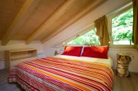 A bed or beds in a room at VILLAGGIO VAL MOLINI
