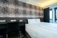 Hotels Here - Taipeiにあるベッド
