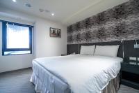 Hotels Here - Taipeiにあるベッド