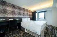 Hotels Here - Taipeiにあるベッド
