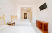 Cama o camas de una habitación en Hotel Manzanito