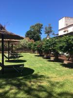 a park with a picnic table and trees and a building at Molino El Mastral in Tarifa