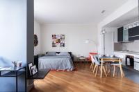 A bed or beds in a room at JOIVY Superb Flat with Home Office