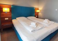 Posteľ alebo postele v izbe v ubytovaní Holiday Home Aparthotel z balkonem przy plaży