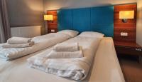 Posteľ alebo postele v izbe v ubytovaní Holiday Home Aparthotel z balkonem przy plaży