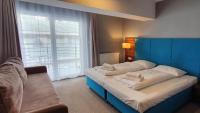 Posteľ alebo postele v izbe v ubytovaní Holiday Home Aparthotel z balkonem przy plaży