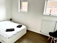 Łóżko lub łóżka w pokoju w obiekcie La Parisienne - 80m2