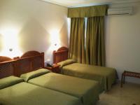 Posteľ alebo postele v izbe v ubytovaní Hotel Castillo de Montemayor