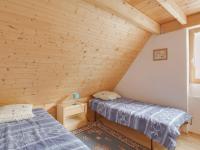 two beds in a room with wooden walls at Maison Luz-Saint-Sauveur, 3 pièces, 4 personnes - FR-1-402-40 in Luz-Saint-Sauveur