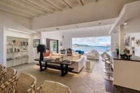 a living room with a couch and a table at Infiniti Entire Luxury Villa Breath Taking View in St Barth in Pointe Milou