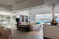 a living room with a view of the ocean at Infiniti Entire Luxury Villa Breath Taking View in St Barth in Pointe Milou