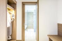 a bathroom with a glass door leading to a shower at Crowne Plaza Vientiane by IHG in Vientiane