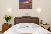 Postel nebo postele na pokoji v ubytování Hotel Alkyon