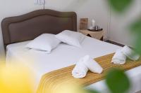 Postel nebo postele na pokoji v ubytování Hotel Alkyon