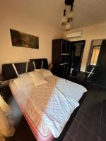 Postel nebo postele na pokoji v ubytování Porto Sharm vib suites