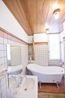 a bathroom with a large tub and a sink at 微笑58民宿 Smile 58 B&amp;B in Puli