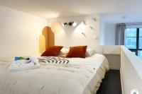 Posteľ alebo postele v izbe v ubytovaní l'Orient-Express - Jacuzzi SPA - Parking - Loft