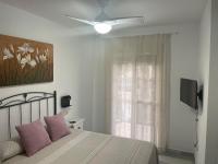 A television and/or entertainment centre at El SOL del SUR