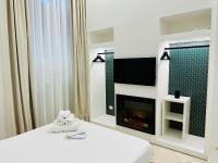 Łóżko lub łóżka w pokoju w obiekcie Garibaldi 118 Luxury Apartment