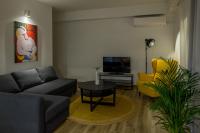 Televízia a/alebo spoločenská miestnosť v ubytovaní Alyvia Central Apartment 1