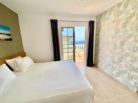 Posteľ alebo postele v izbe v ubytovaní Medano Beach - Villa Playa