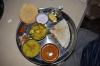 een bord met verschillende soorten voedsel bij Suma beach resort in Dapoli