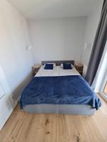 Łóżko lub łóżka w pokoju w obiekcie Apartament CARO