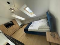 Posteľ alebo postele v izbe v ubytovaní Apartament Amelia