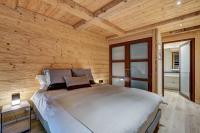 Łóżko lub łóżka w pokoju w obiekcie Appartement Legno - Welkeys