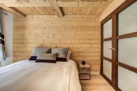 Łóżko lub łóżka w pokoju w obiekcie Appartement Legno - Welkeys