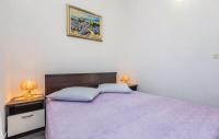 Posteľ alebo postele v izbe v ubytovaní Apartmani Ivanković