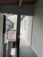 an empty hallway with a staircase in a building at Résidence Pelloutier Appartement F in Vénissieux