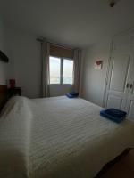 Postel nebo postele na pokoji v ubytování By The Sea Apartment Corralejo