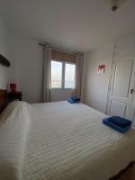 Postel nebo postele na pokoji v ubytování By The Sea Apartment Corralejo