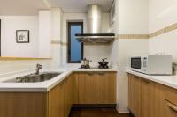 A kitchen or kitchenette at Belgravia Serviced Residence Wuxi