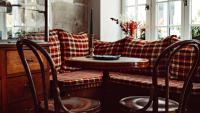 a table and chairs in a room with a couch at Maison Saintonge in Paris