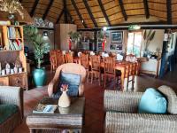 a dining room with a table and chairs at Roaring Sky Base Camp in Baviaanspoort