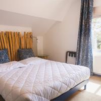 a bedroom with a bed and a window at Hotel et Studios Le Marina Baie de La Baule in Pornichet