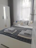 Posteľ alebo postele v izbe v ubytovaní Apartament FANABERIA Lądek Zdrój