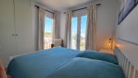 Postel nebo postele na pokoji v ubytování Moderne Penthouse-Whg am Hafen von Cala d'Or / WLAN, Klimaanlage, Pool