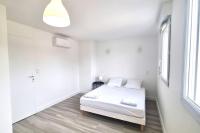 Łóżko lub łóżka w pokoju w obiekcie Résidence Anthérieu - Appartements neufs tout confort