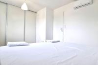 Łóżko lub łóżka w pokoju w obiekcie Résidence Anthérieu - Appartements neufs tout confort