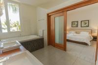 Postel nebo postele na pokoji v ubytování Ultravioleta Boutique Residences