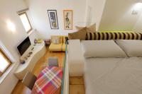 Posteľ alebo postele v izbe v ubytovaní Siena UpTown - Sabrina's Cozy Apartment