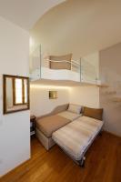 Posteľ alebo postele v izbe v ubytovaní Siena UpTown - Sabrina's Cozy Apartment