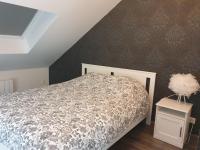 Łóżko lub łóżka w pokoju w obiekcie Les toits - Audun le Tiche - Appartement 3 chambres